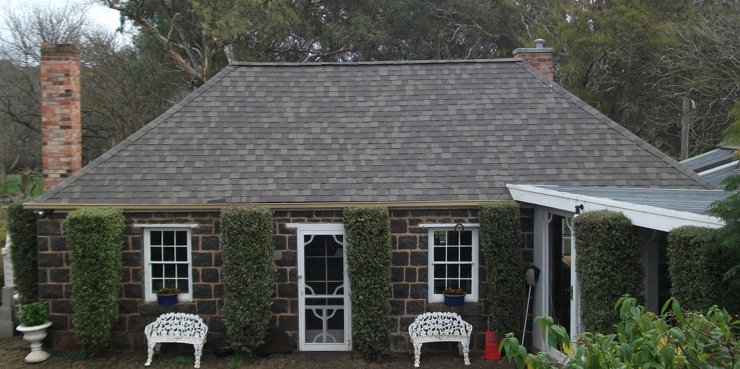 Happy customer with new roof shingles Australia