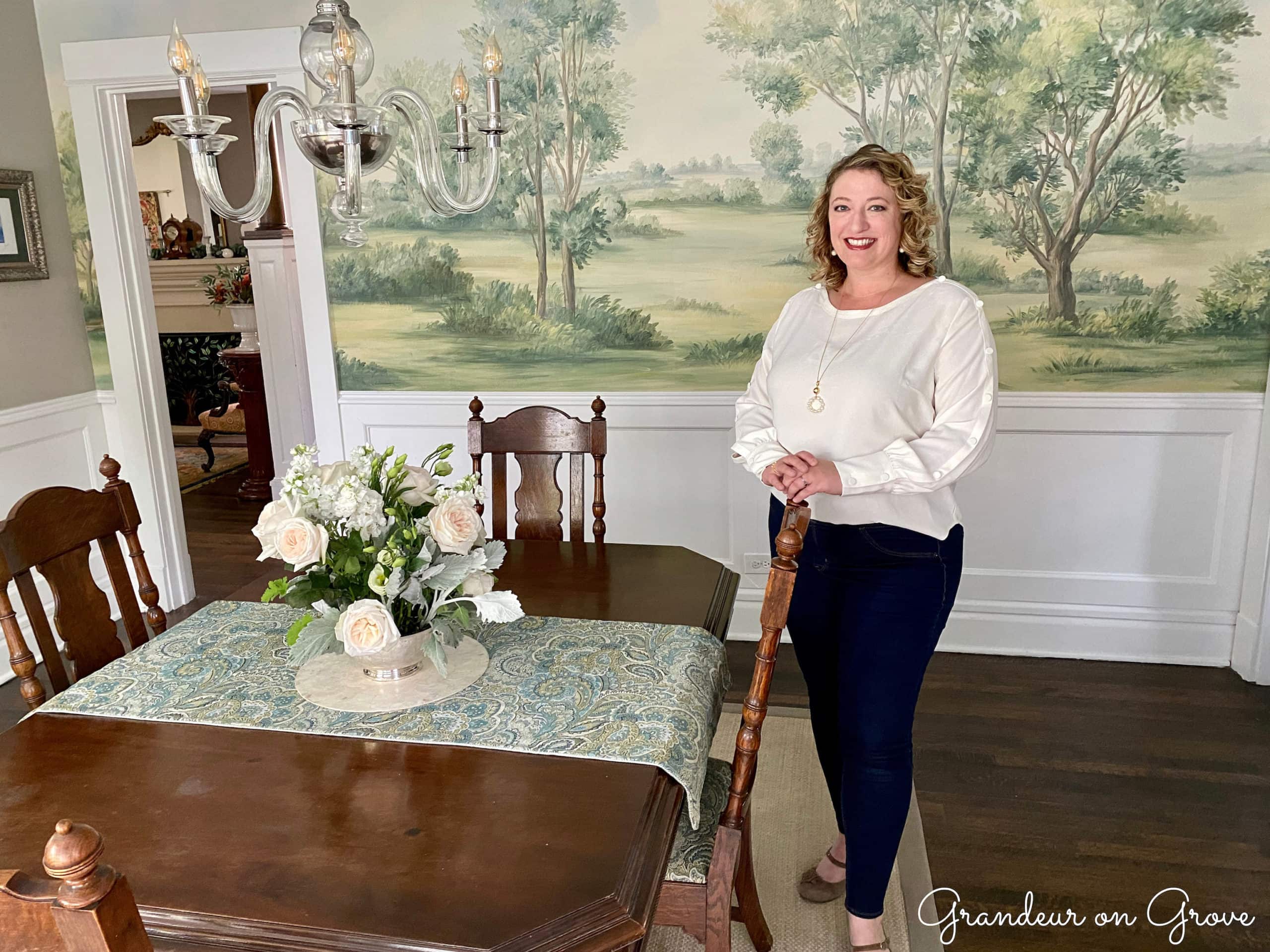 Kristi Gundrum Kebinger stands in her dining room beside the dining table