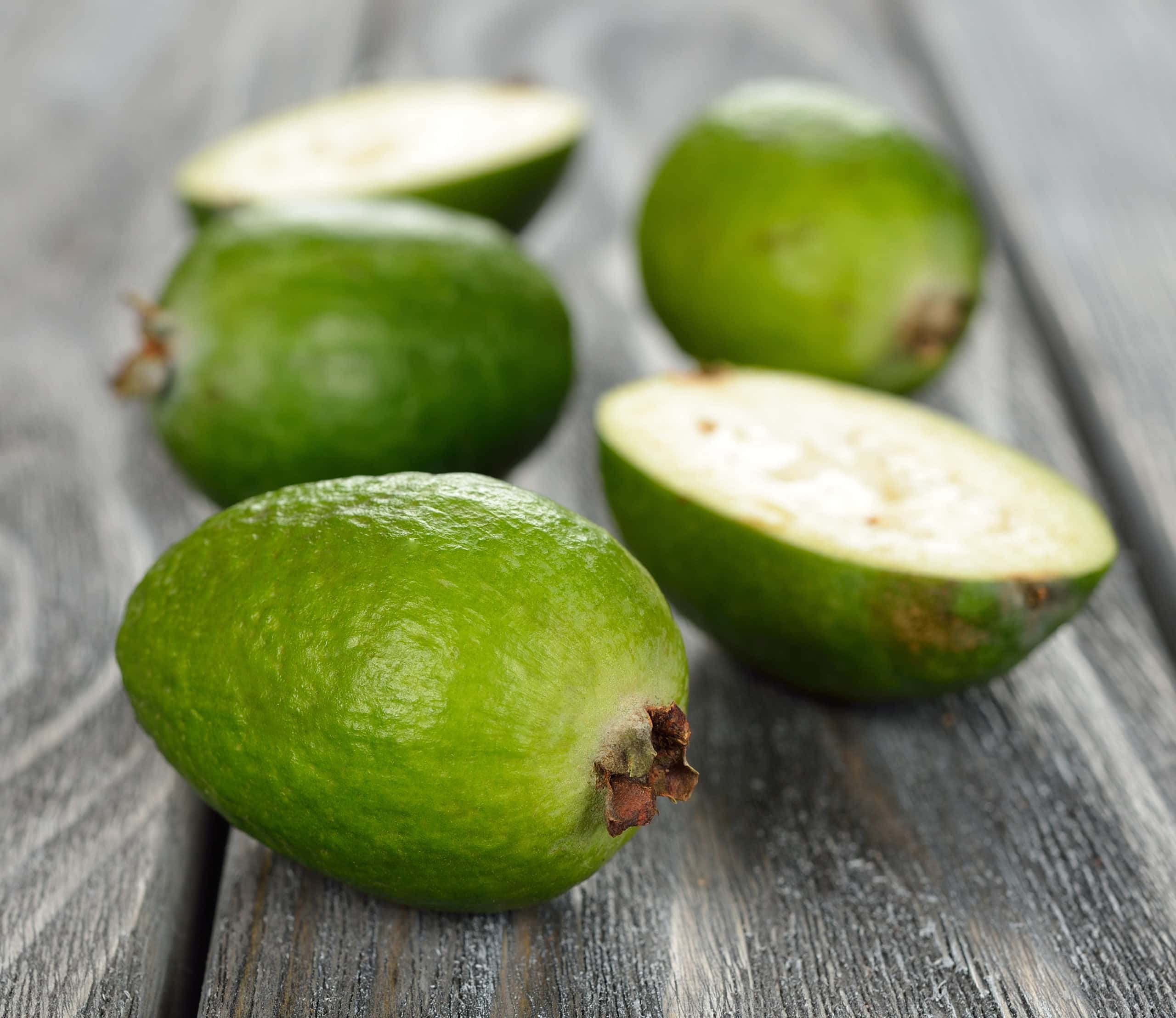 feijoa fruit on a wooden background