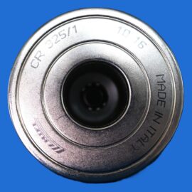 Close-up of a metallic circular dial or knob against a bright blue background, with engraved numbers around the edge.