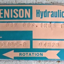 Denison Hydraulics nameplate on equipment showing model and code numbers with a rotation arrow indicating direction and serial number.