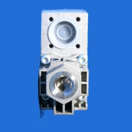 Close-up of a gray industrial electrical connector module with a circular socket and mounting screws against a blue background.