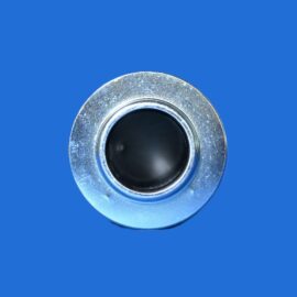 Close-up of a metallic circular dial with a black center on a solid blue background.