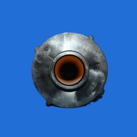 Close-up of a metallic circular component with an orange center on a blue background.