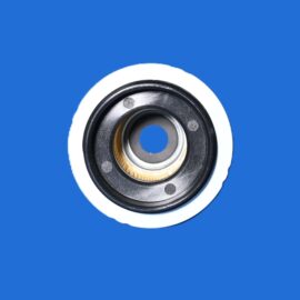 Close-up of a camera lens mount with a central hole, set against a bright blue background.