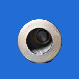 Close-up of a silver circular metal component with a dark inner hole on a blue background, cropped to show the outer edge and part of the ring.