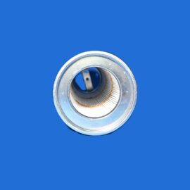 Close-up of a metal bearing with inner and outer rings against a solid blue background