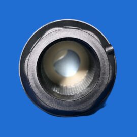 Close-up of a silver metal bearing ring with a textured outer surface on a blue background.