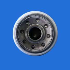 Close-up of a metallic wheel hub with circular holes against a solid blue background in a macro shot