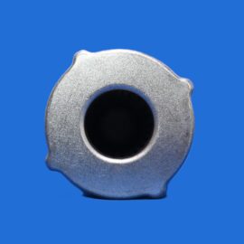 Close-up of a silver metal nut or socket with a round hollow center on a blue background, showing textured surface detail.