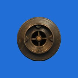 Close-up of a circular metal mechanical part with three spokes and a central hub on a solid blue background.