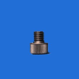 Close-up of a metal screw with threaded shaft against a solid blue background.