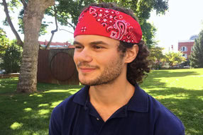 Lucas Peterson proudly shows off his headband bandana outside of Knutti Hall.