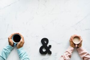 couple holding coffee cups