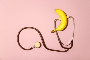 Why Does My Wife Not Want to Make Love Anymore? 4 a banana and a stethoscope on a pink surface