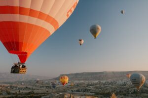 The Ultimate Guide to Valentine's Day Gifts for Him 7 colorful air balloons flying over old eastern city