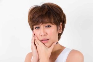 Woman suffering from bruxism