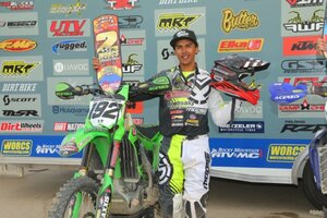 JP Alvarez standing with his KX250 at the 2020 Primm WORCS race
