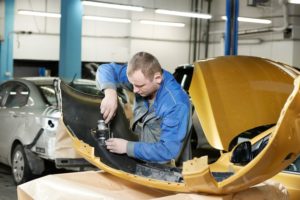 auto body school collision repair training education young man learning