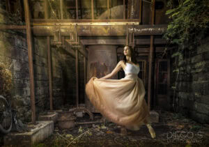 Elegant fine art portrait of a woman in a flowing dress photographed in an abandoned architectural setting by Atlanta portrait photographer Diego Salcedo.