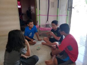 Kids playing Monopoly deal