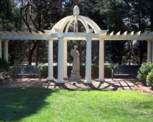 Springtime sculpture from Kenneth Lynch and Sons in Connecticut. The pergola, a gift from her children, was made in Charleston and sent to Charlotte. 