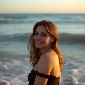 Woman standing near ocean with soft smile