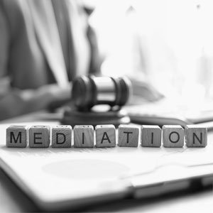 Legal Mediation: Gavel and letter blocks.