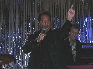 John Sawoski playing with Jon Lovitz in The Wedding Singer