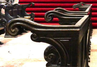 Stall with long armrest. Seating ensemble on the side of the choir called Stalles and reserved for the clergy