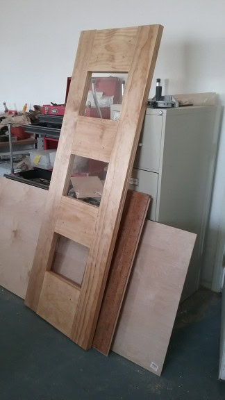 and the door, awaiting the hardware drilling and hanging