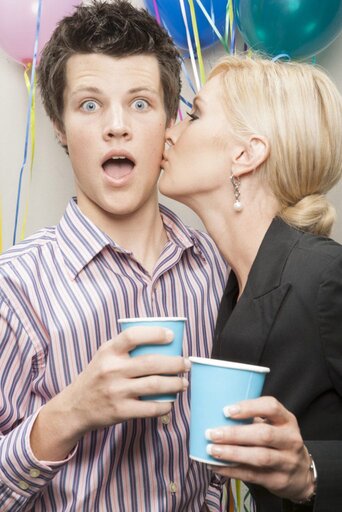 How to Get Your Boyfriend to Text You First 4 office people flirting at party rt gKAxCHo 1
