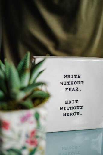 Blogging - White block with "write without fear, edit without mercy" printed on it
