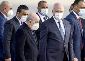 Tunisia's President Kais Saied (C-R) receives Algeria's President Abdelmajid Tebboune (C-L) as the latter arrives at Tunis-Carthage International Airport, Tunis, Tunisia, Dec. 15, 2021. - Fethi Belaid/AFP via Getty Images