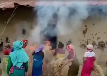 Women put burning hays in house of the accused in viral Manipur video case, in Pechi Awang Leikai, Manipur, India, July 20, 2023, in this screengrab obtained from a Handout video. ANI/via REUTERS INDIA OUT. NO COMMERCIAL OR EDITORIAL SALES IN INDIA. THIS IMAGE HAS BEEN SUPPLIED BY A THIRD PARTY.
ANI via REUTERS