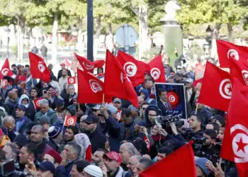 Hundreds of opposition supporters march through the streets to demand that President Kais Saied step down.