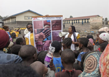 This photo supplied by MSF (Doctors Without Borders) dated May 31, 2023, shows health workers educating children on the symptoms of the mpox disease in Goma, Congo.   (Augustin Mudiayi/Doctors Without Borders/Médecins Sans Frontières via AP)