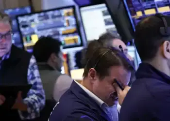 Traders work on the floor of the New York Stock Exchange (NYSE) at the opening bell in New York City, on April 3, 2025. Wall Street stocks sank in early trading. Charly Triballeau/AFP via Getty Images