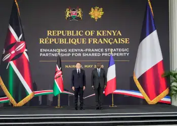 French President Emmanuel Macron, left, and Kenyan President William Ruto shake hands at State House in Nairobi, Kenya, Sunday, May 10, 2026. (AP Photo/Brian Inganga)
