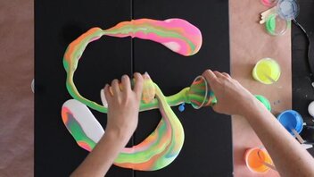 paint being poured on canvases