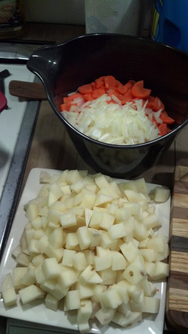 So my first cook is just some veggie/rice soup. My boss and his wife gave me an entire Thanksgiving dinner again this year, including the turkey and a bottle of wine that taunts me every day :) I used some of the veggies and made this delicious soup!