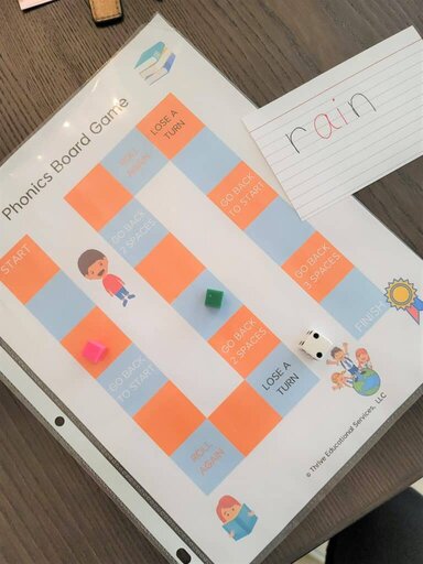 printable phonics board game for long u words activity