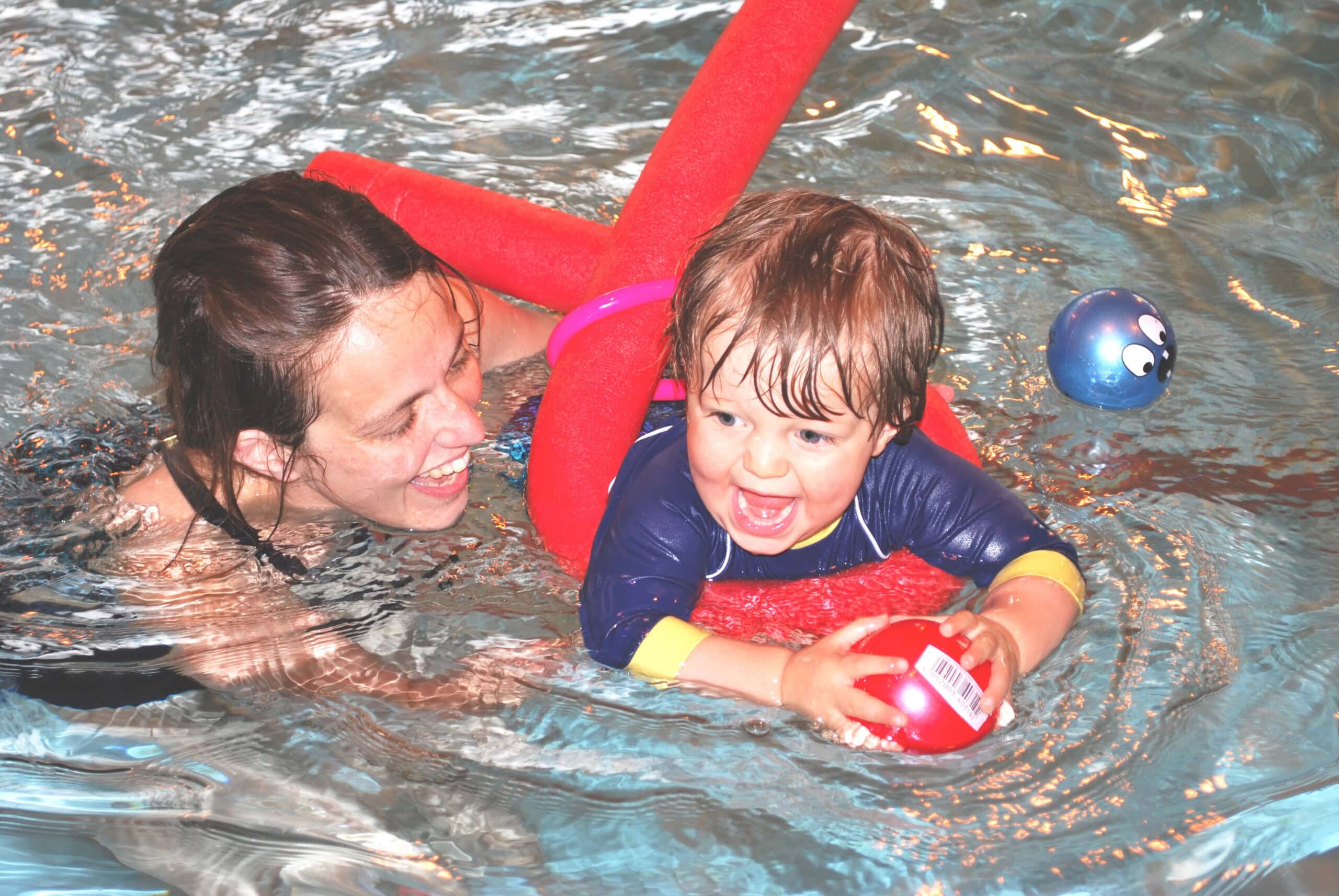 Parent and baby swimming class uses floats and toys at Blue Wave
