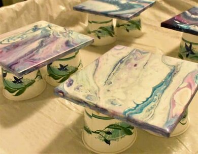 acrylic poured tile coasters on Dixie cups