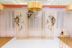 wonderful wedding ceremony. trendy wedding arch made according to modern fashion. wedding decorations.