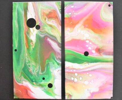 Fluid art black canvas painting with bright neon colors and black circles