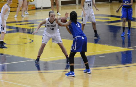 Cara Mason guarding a Glenville State Pioneer 