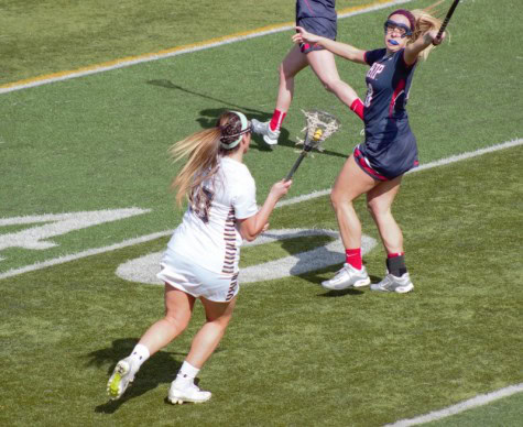 Kelsey Phalen looks for open teammates as she is guarded by Shippensburg