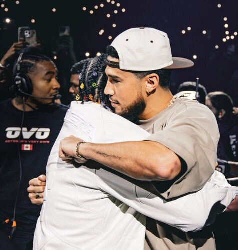 Drake dons a Devin Booker Moss Point jersey during Arizona concert