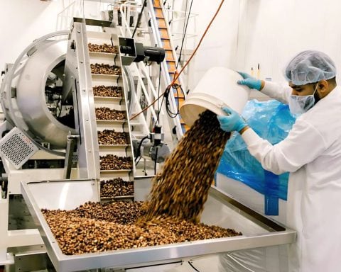 A worker prepares pulse-based snacks for Three Farmers Food